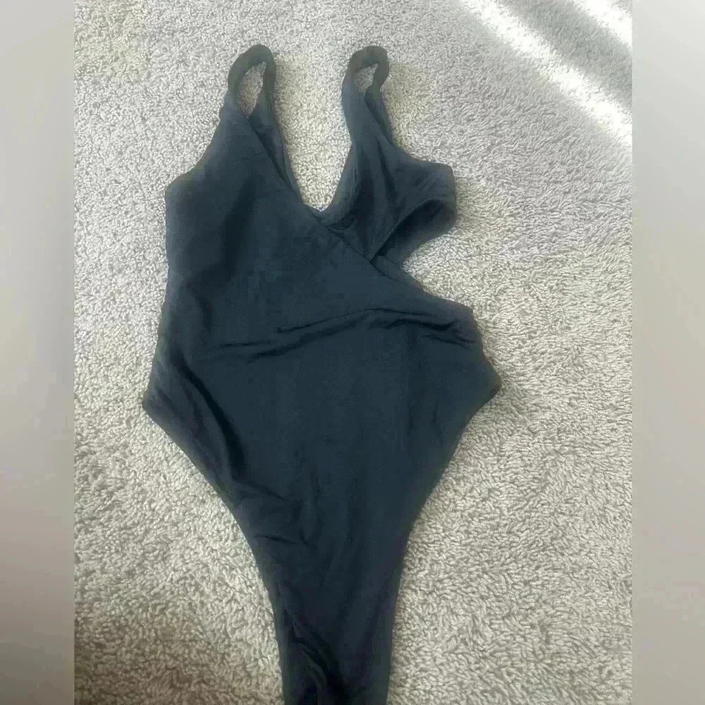 Black one piece bathing suit.